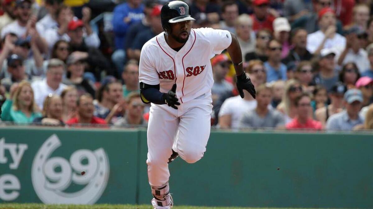 Boston Red Sox's Jackie Bradley Jr. runs toward first base as he singles off a pitch by Cleveland Indians' Danny Salazar in the fifth inning of a baseball game at Fenway Park, Sunday, May 22, 2016, in Boston.