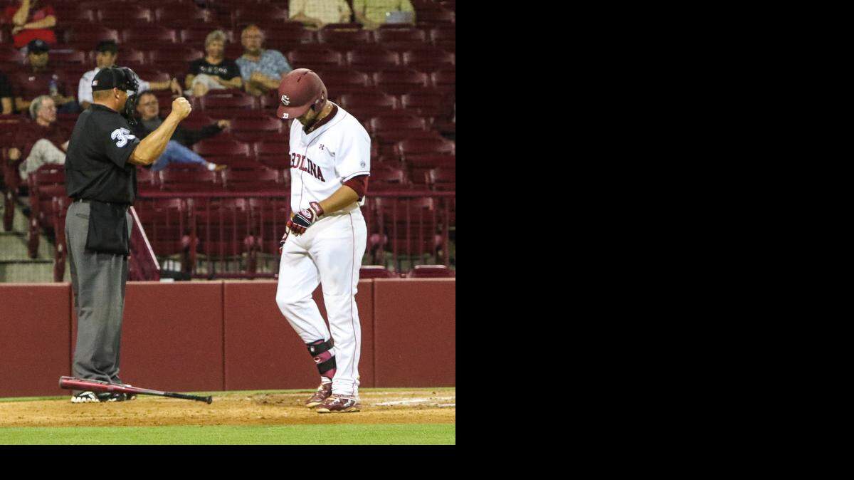 
South Carolina’s Kyle Martin throws down his bat after striking out during the Gamecocks’ loss to Presbyterian on Tuesday night at Carolina Stadium.
