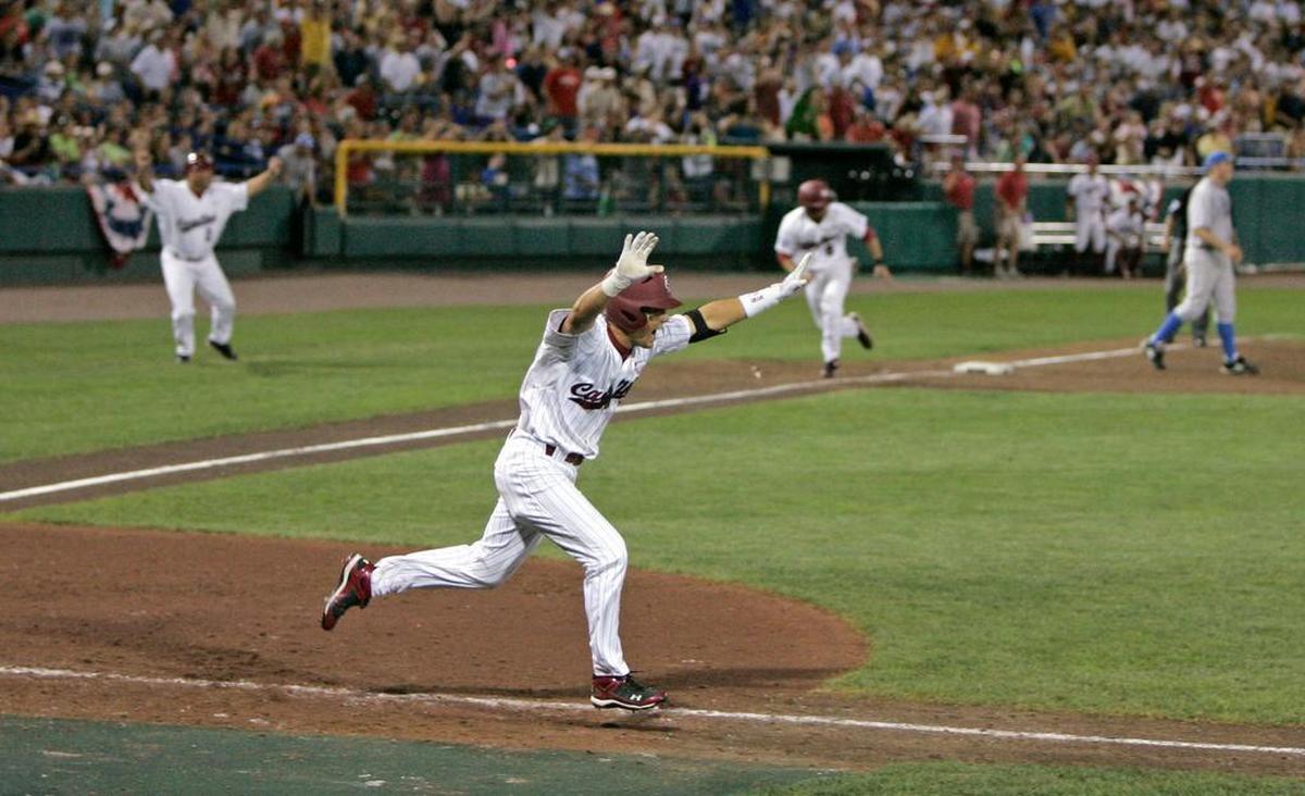 On June 29, 2010: South Carolina’s Whit Merrifield drives in the winning run in the 11th inning during the series-clinching game two of the 2010 College World Series against UCLA.