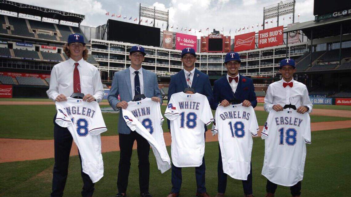 South Carolina baseball signee Owen White and the rest of Texas Rangers' top draft picks pose for a photo in Arlington, Texas, on Tuesday. White, a second-round pick, signed his contract and will begin his professional baseball career instead of playing college baseball at USC.
