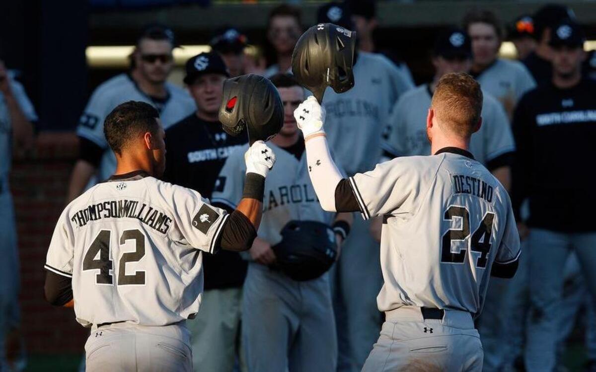 South Carolina’s Dom Thompson-WIlliams, left, and Alex Destino tap helmets after Destino's 3-run homer in the fourth inning Friday at Cliff Hagan Stadium in Lexington, Ky.