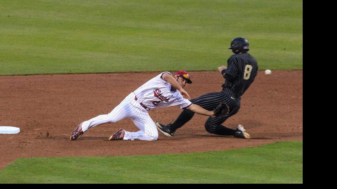 
South Carolina’s Max Schrock can’t get to a wild throw as Vanderbilt’s Rhett Wiseman steals second.

