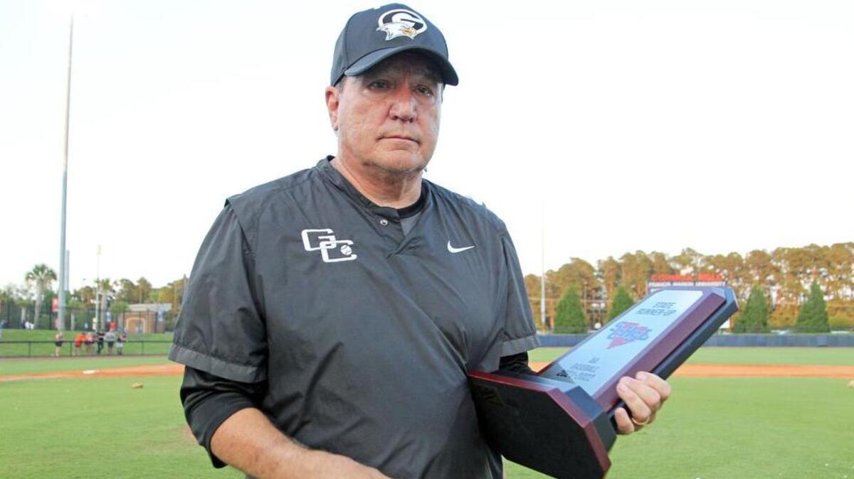 Gray Collegiate coach Charles Assey Sr. holds the runner-up trophy after the War Eagles lost to Andrew Jackson in the Class 2A baseball state championship series. The third and final game of the series was played Saturday, May 28, 2022 at Francis Marion University’s Cormell Field.