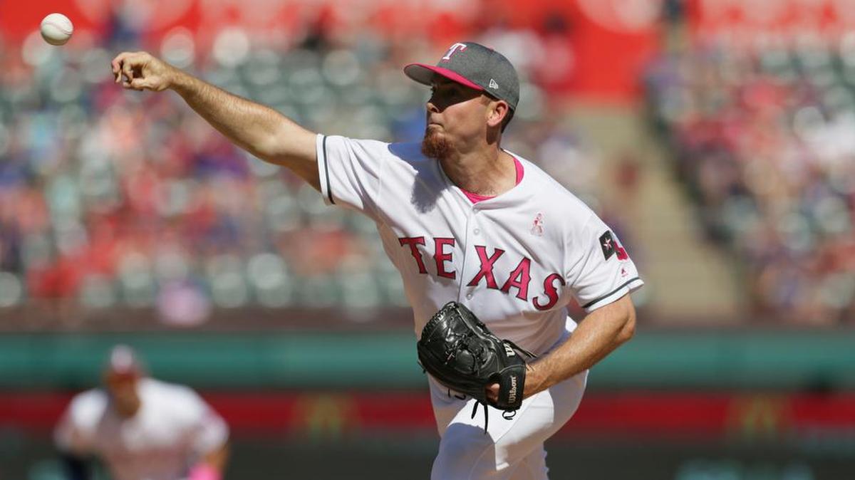Texas Rangers relief pitcher Sam Dyson throws during a baseball game against the Oakland Athletics. He has been traded to San Francisco.