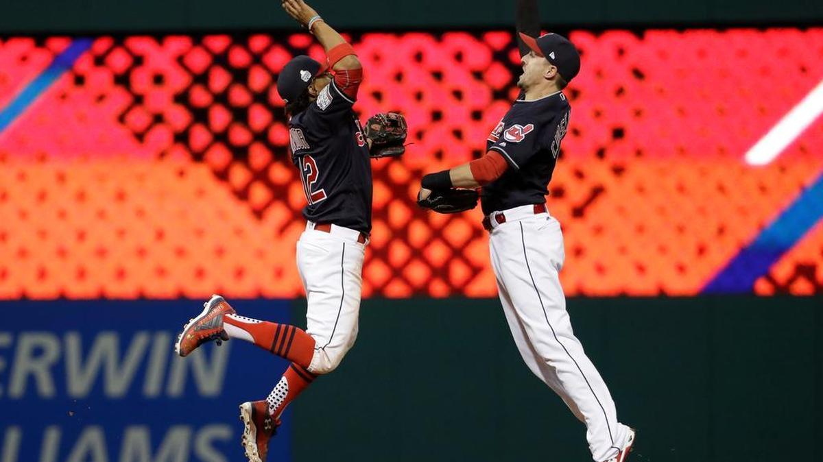Cleveland Indians' Lonnie Chisenhall (right) and Francisco Lindor celebrate after Game 1 of the Major League Baseball World Series against the Chicago Cubs Tuesday, Oct. 25, 2016, in Cleveland. (AP Photo/David J. Phillip)