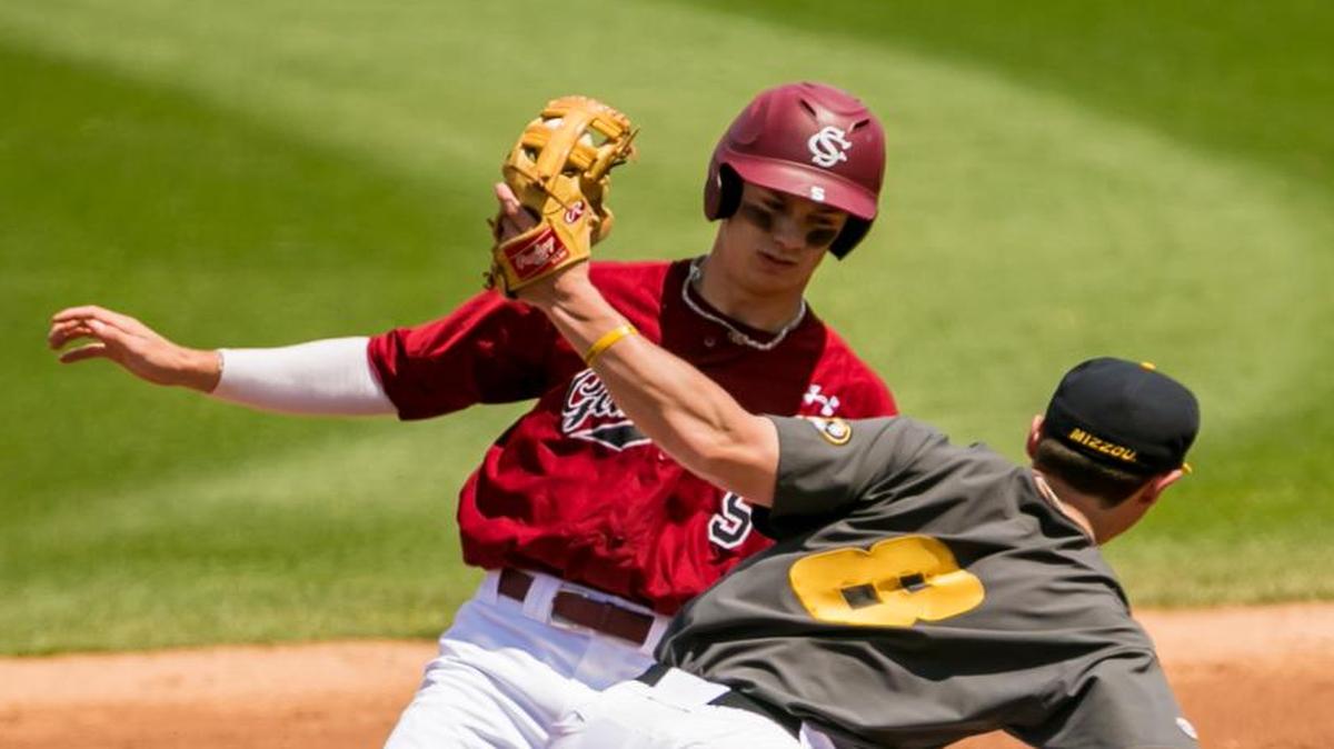 South Carolina outfielder TJ Hopkins (5) steals a base against Missouri on Sunday.