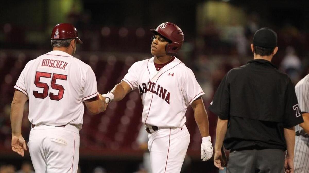 Brandon McIlwain is congratulated Tuesday night after his first career hit.