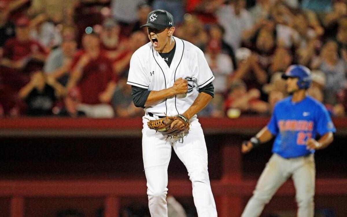 South Carolina's Tyler Johnson celebrates after striking Florida's JJ Schwarz to end the top of the 8th at Founders Park in Columbia.