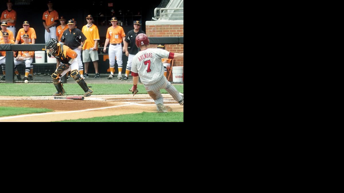 
South Carolina’s DC Arendas slides safely into home as Tennessee catcher Benito Santiago waits for the ball during Saturday’s game at Lindsey Nelson Stadium.
