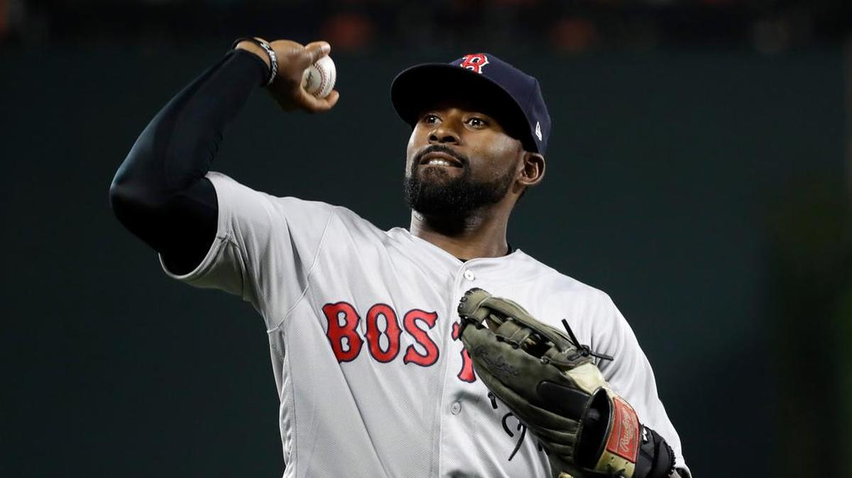 Boston Red Sox center fielder Jackie Bradley Jr. throws a ball into the stands in a game this past season.