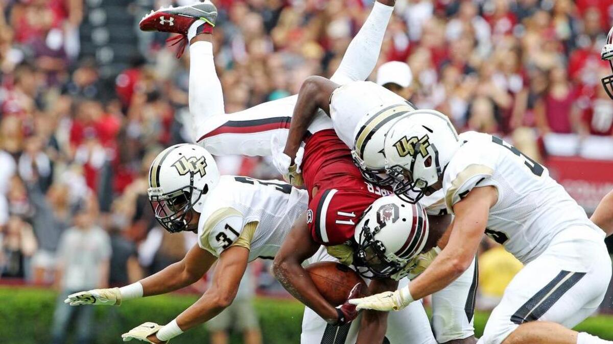 
South Carolina wide receiver Pharoh Cooper gets airborne as he stretches for extra yards during the first half Saturday against UCF at Williams-Brice Stadium.
