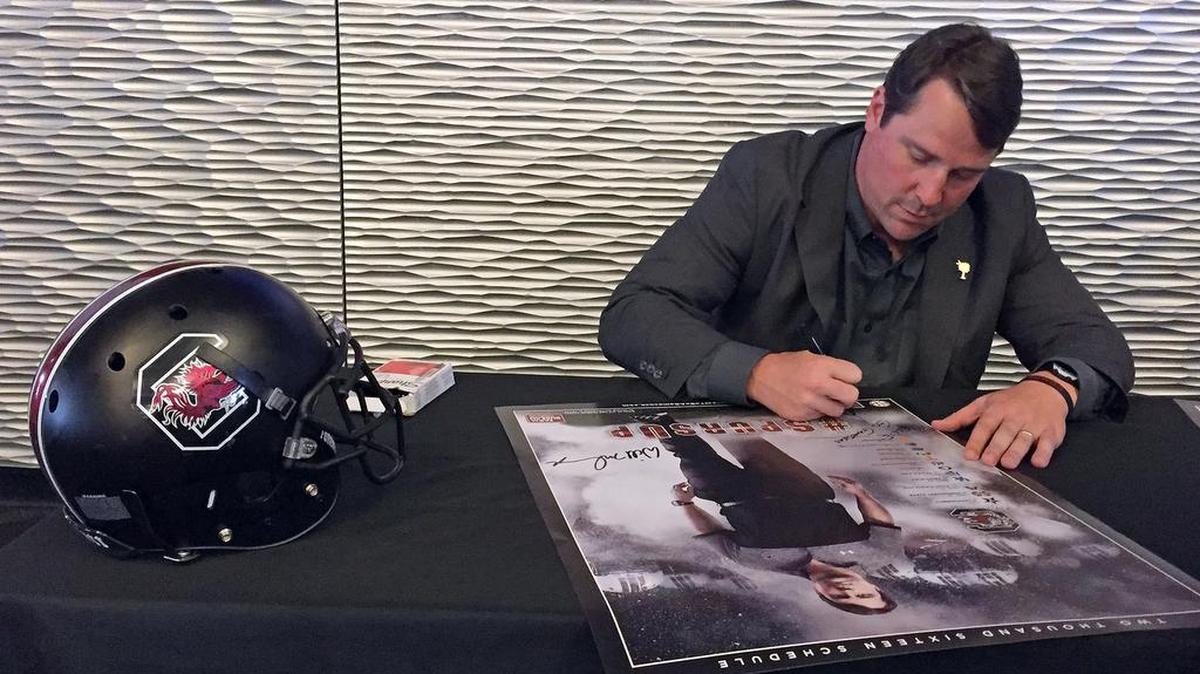 Will Muschamp signs autograph at the first Gamecock Club meeting on this year’s Spurs Up Tour, held Wednesday night at Williams-Brice Stadium.