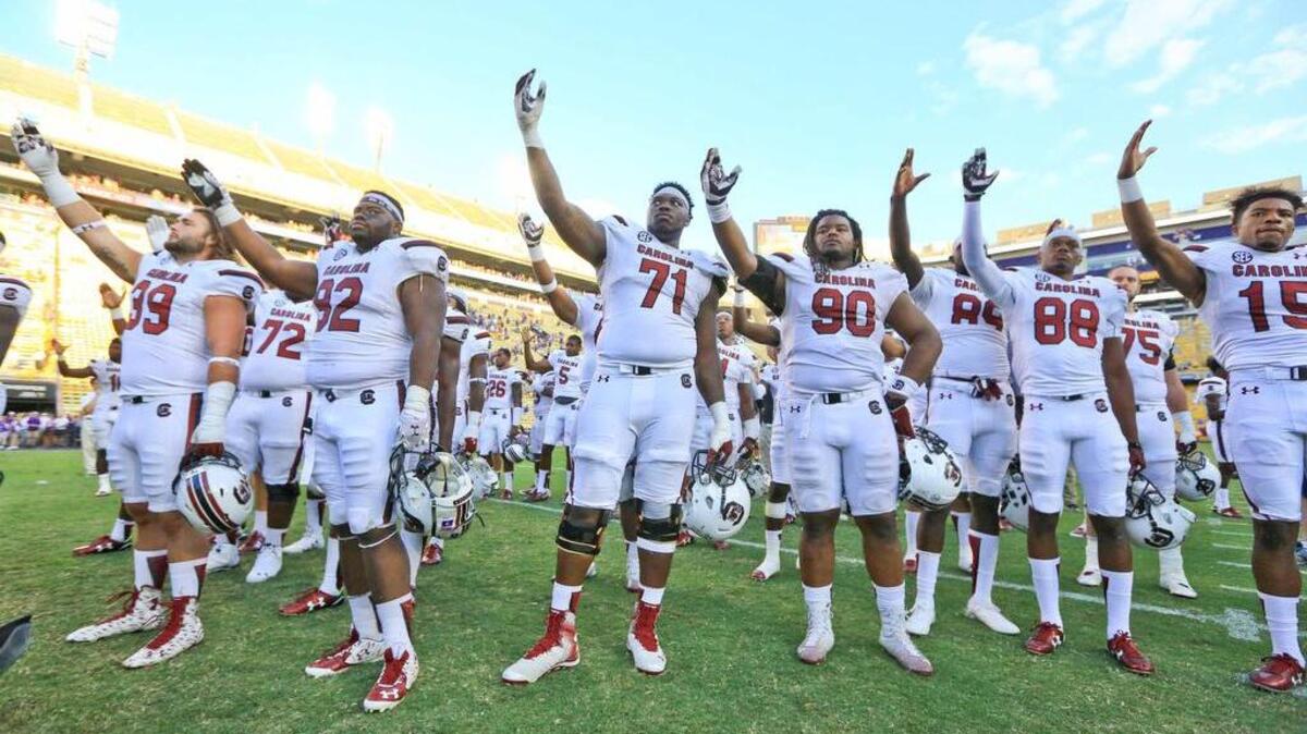 
South Carolina Gamecocks players stand as their alma mater is played by the LSU Tigers band following a relocated home game at Tiger Stadium. LSU defeated South Carolina 45-24. Mandatory Credit: Derick E. Hingle-USA TODAY Sports
