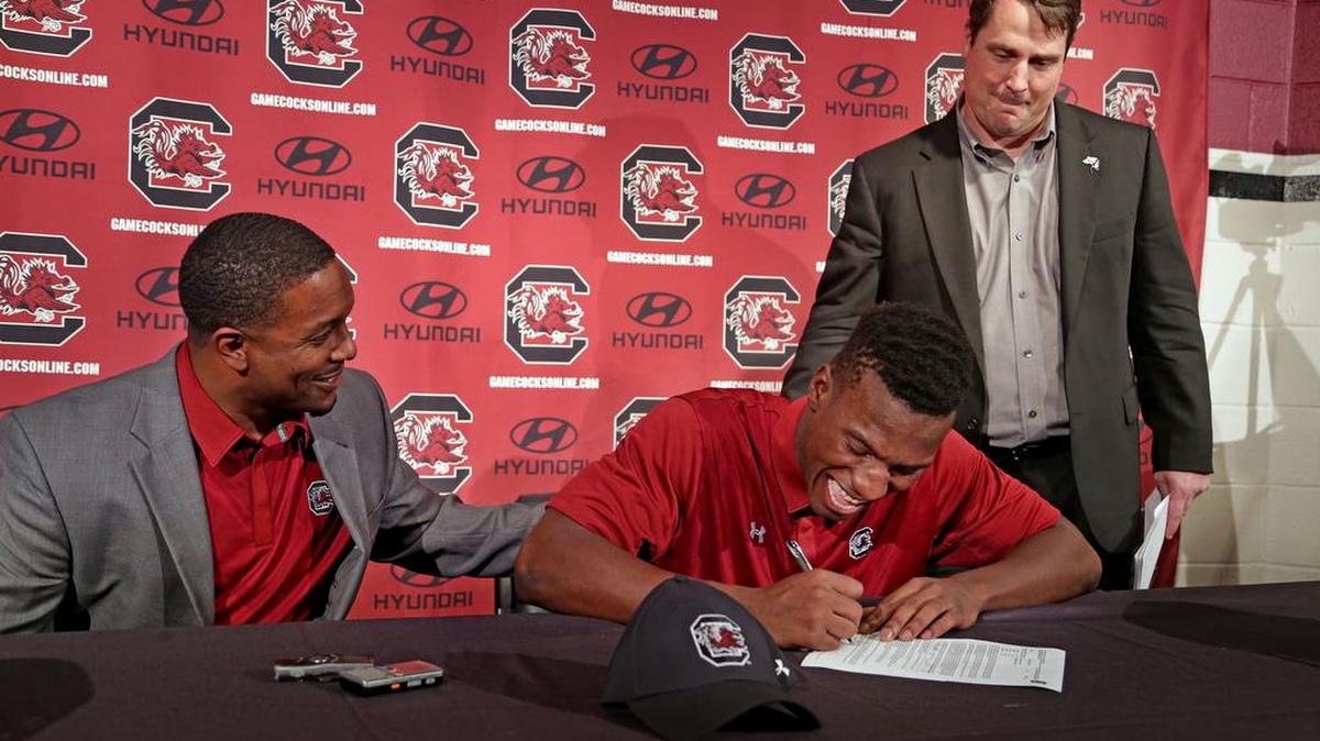 Bryan Edwards takes part last week in a signing ceremony for all of South Carolina’s midyear enrollees.
