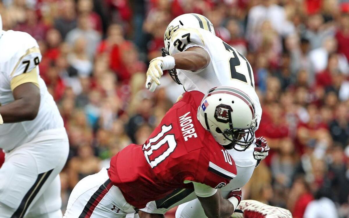 
South Carolina linebacker Skai Moore (10) brings down UCF running back Taj McGowan in the first half at Williams-Brice Stadium on Saturday. Moore recorded nine tackles in the win.
