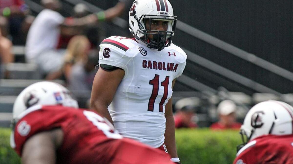 
T.J. Holloman will stick at middle linebacker after intercepting two passes against UCF. 
