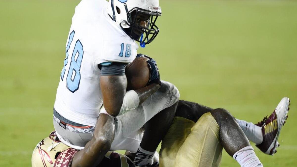Citadel Bulldogs wingback Cam Jackson (18) is part of a multi-threat running game