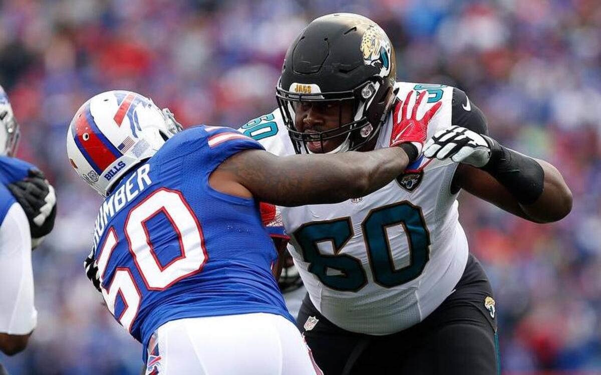 Buffalo Bills linebacker Ramon Humber (50) and Jacksonville Jaguars offensive guard A.J. Cann (60)