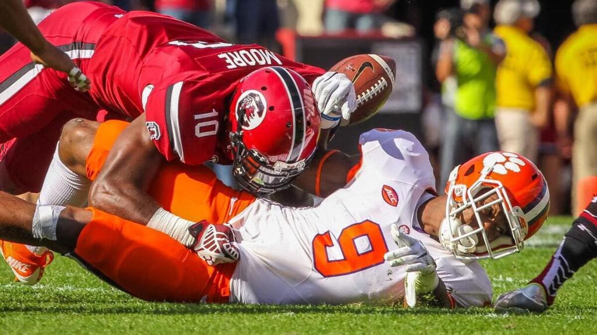 South Carolina linebacker Skai Moore causes Clemson running back Wayne Gallman to fumble during the USC-Clemson game Saturday.