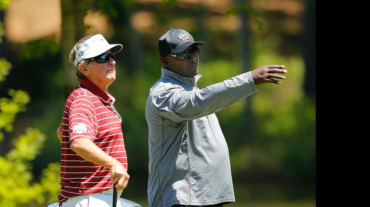 
Team South Carolina’s Steve Spurrier, left, and Sterling Sharpe discuss their drive during the 2015 Chick-fil-A Peach Bowl Challenge Round on the Oconee Course at Reynolds Plantation on Tuesday, April 28, 2015.
