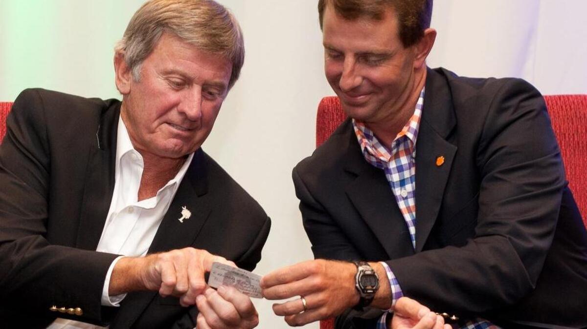 Steve Spurrier and Dabo Swinney at Fisher DeBerry's Coaches for Charity event in 2014