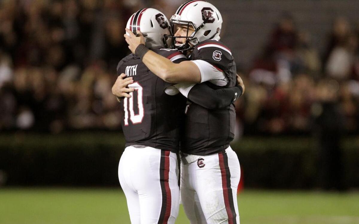 South Carolina senior quarterback Perry Orth (10) is welcomed on the field by Jake Bentley (4) as he takes over in the fourth quarter against Western Carolina.