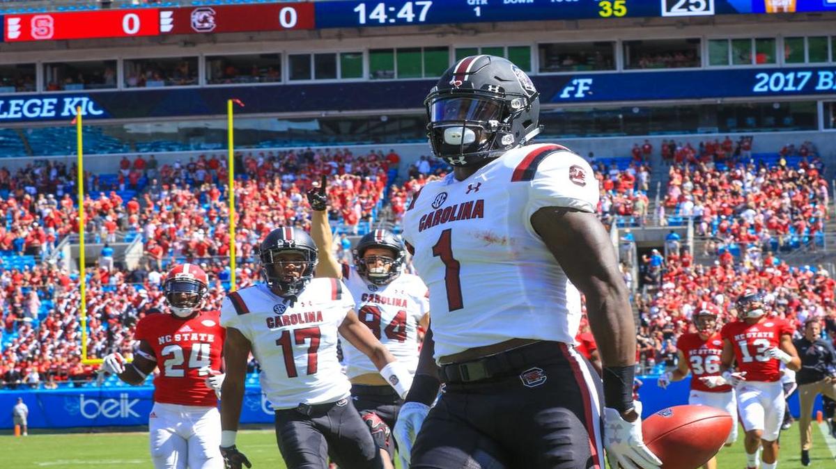 South Carolina wide receiver Deebo Samuel (1) returns the opening kickoff for a touchdown during of the first half of their game against North Carolina State at Bank of America stadium in Charlotte, NC.