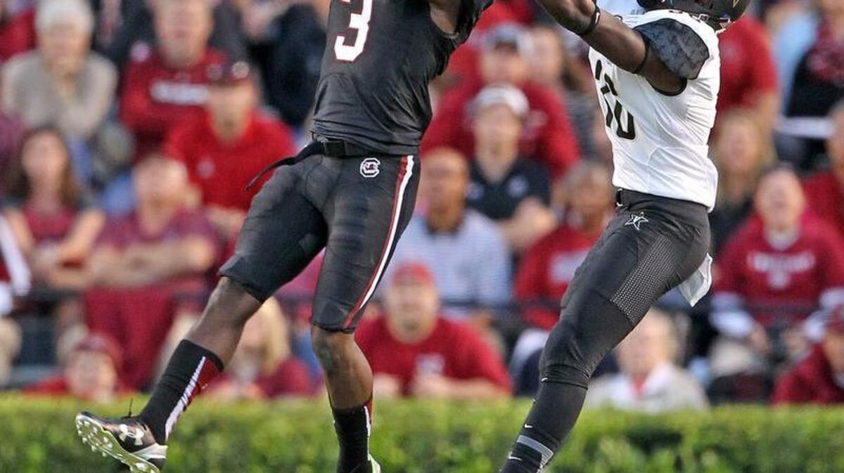 
South Carolina cornerback Chris Lammons intercepts a ball intended for Vanderbilt wide receiver Trey Ellis in the second half Saturday. Lammons’ pick was one of three interceptions by the Gamecocks.

