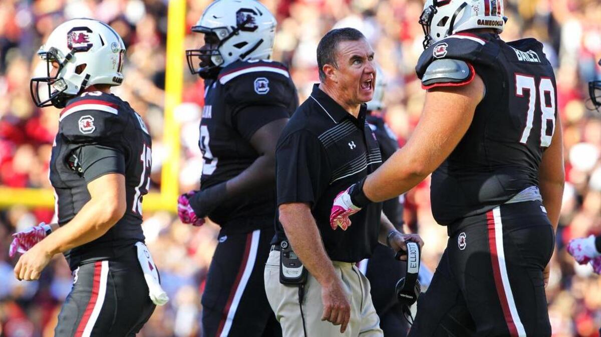 USC head football coach Shawn Elliott talks to South Carolina guard Zack Bailey (78) during their game against Vanderbilt.