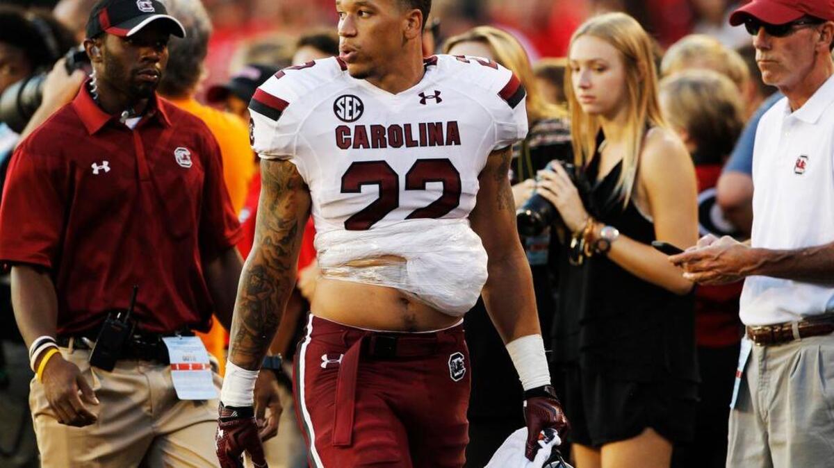 
South Carolina Gamecocks running back Brandon Wilds walks off the field after an injury in the first half at Sanford Stadium in Athens, Ga, Saturday, September 19, 2015.
