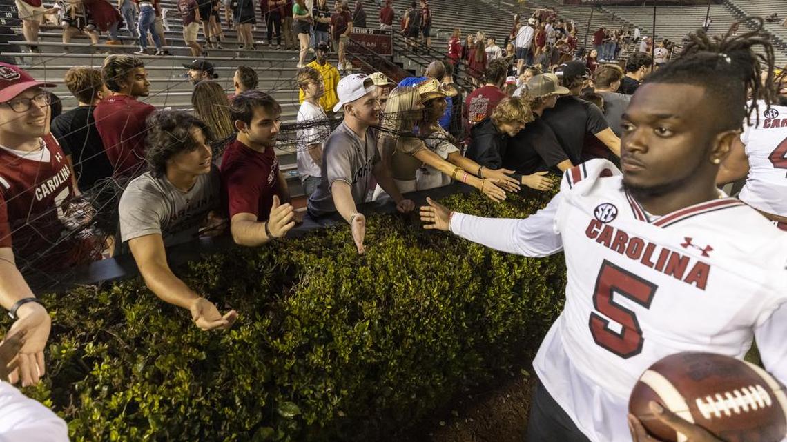 Dakereon Joyner and the Gamecocks greet fans after the 2022 spring game held at night at Williams-Brice Stadium on April 16.