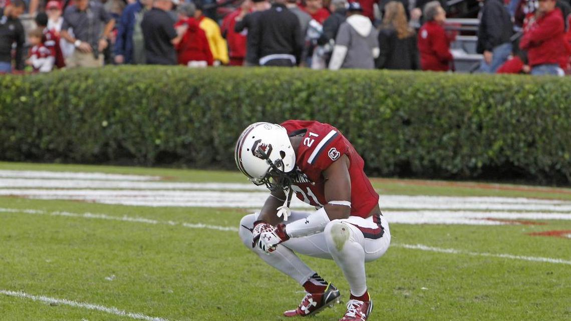 South Carolina safety Isaiah Johnson (21) reacts as the Citadel Bulldogs prepare to run out the clock for a 23-22 win at Williams-Brice Stadium.