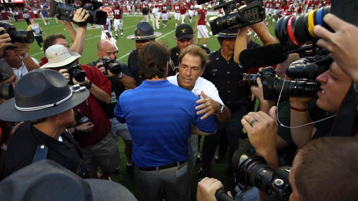 Alabama Crimson Tide coach Nick Saban greets Will Muschamp after a 2014 game.
