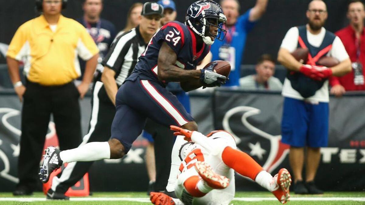Houston Texans cornerback Johnathan Joseph (24) intercepts a pass intended for Cleveland Browns running back Duke Johnson (29) and returns the interception for a touchdown during the second quarter at NRG Stadium.