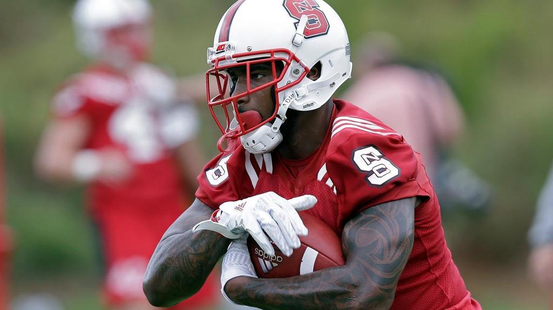 North Carolina State's Jaylen Samuels runs the ball during the team's first NCAA college football practice of the season in Raleigh on Saturday.