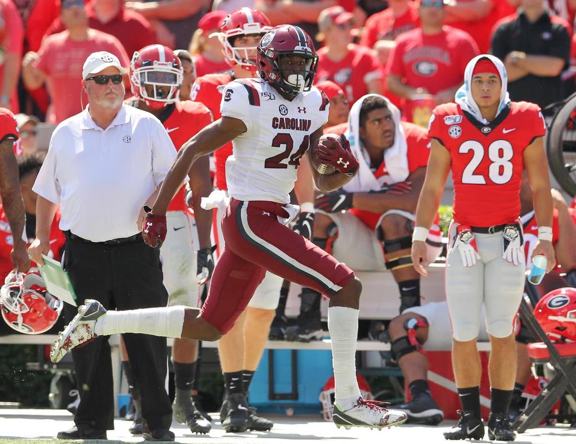 South Carolina defensive back Israel Mukuamu (24) intercepts a Georgia pass for a touchdown during second-quarter action in Athens in 2019.