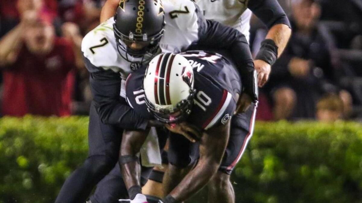 
South Carolina linebacker Skai Moore recovers a fumble by Vanderbilt quarterback Johnny McCrary (2) in the second half of the Gamecocks’ win Saturday.
