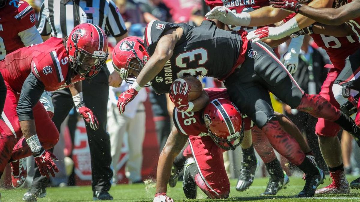 South Carolina running back David Williams (33) is tackled by South Carolina safety Jasper Sasser (26) during the Garnet and Black Spring Game at Williams-Brice Stadium.
