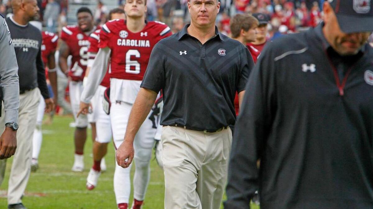 South Carolina coach Shawn Elliott walks off the field after the Gamecocks’s 23-22 loss to The Citadel.