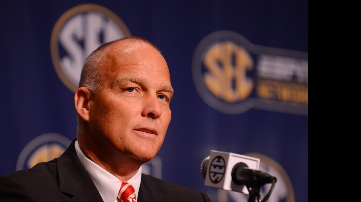 
Georgia Bulldogs coach Mark Richt talks to reporters during SEC media days at the Wynfrey Hotel. 
