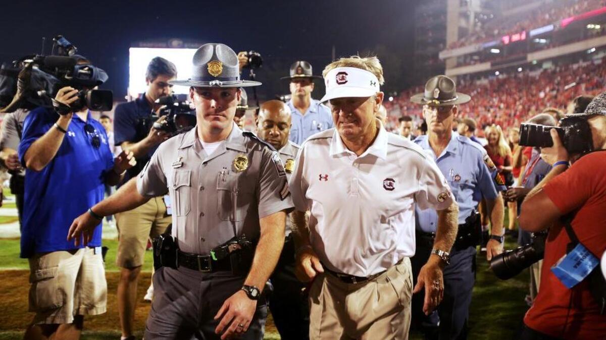 
USC coach Steve Spurrier walks off the field after a loss to Georgia at Sanford Stadium in Athens, Ga., on Saturday.
