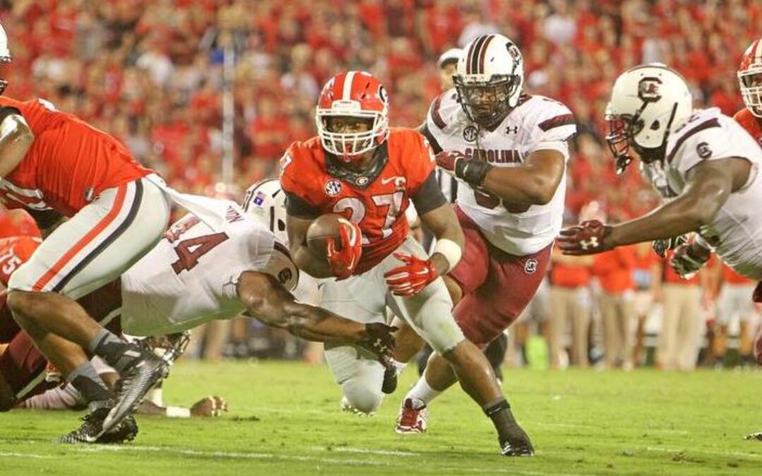 Georgia running back Nick Chubb breaks through the line in the second half in Athens, Ga, Saturday, September 19, 2015.