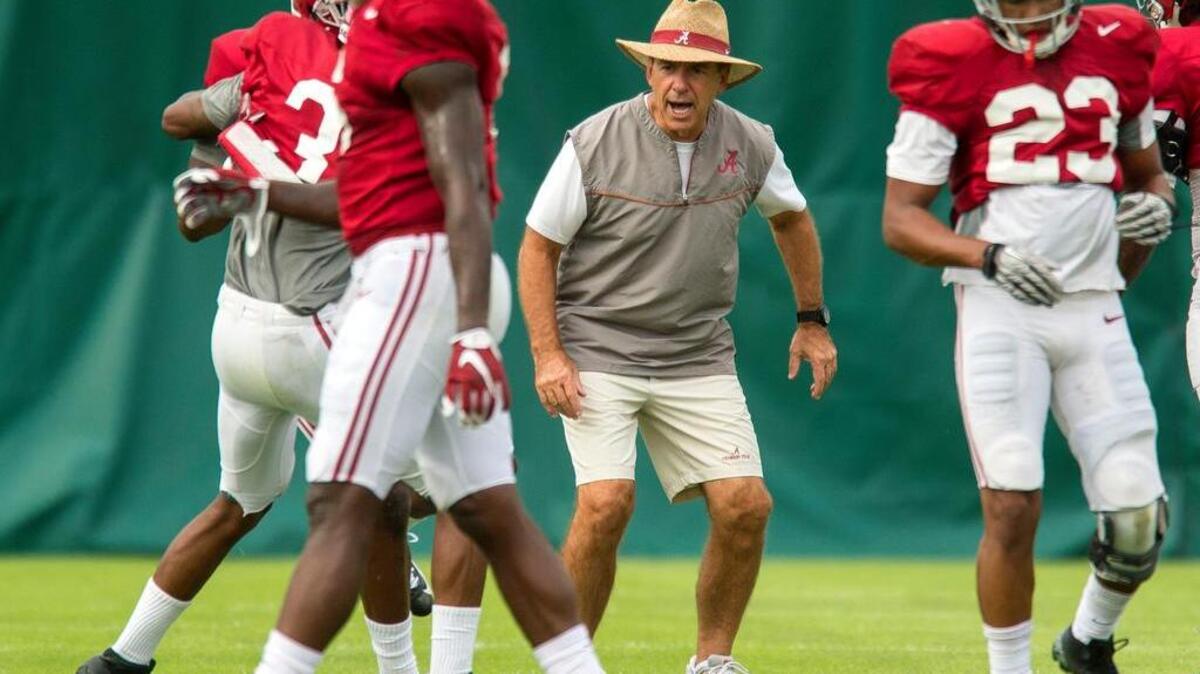 
Alabama head coach Nick Saban works with his players during an NCAA college football practice, Tuesday, Sept. 29, 2015, in Tuscaloosa, Ala. (Vasha Hunt/The Tuscaloosa News via AP) MANDATORY CREDIT
