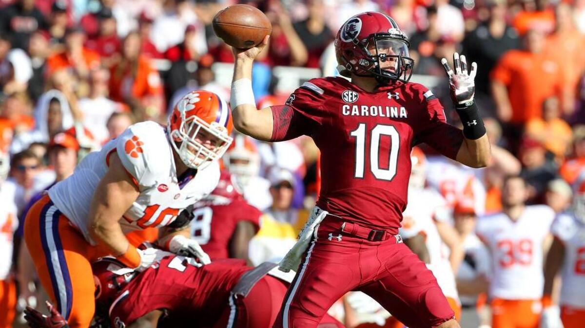 South Carolina Perry Orth’s delivers a pass last season. The USC quarterbacks must improve their touchdown-to-interception ratio this year.