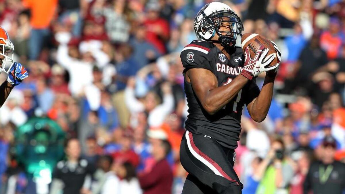 Gamecocks wide receiver Pharoh Cooper scores a touchdown on a long pass play against Florida. The former high school quarterback also threw a touchdown in the loss.