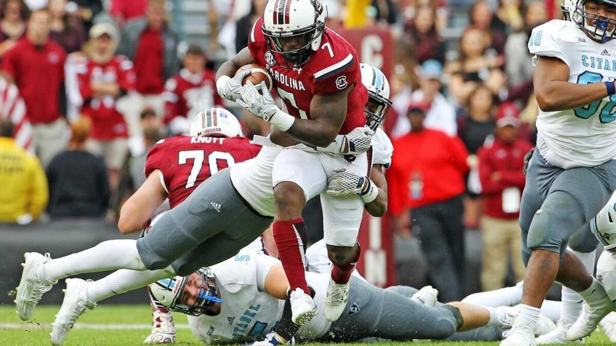 South Carolina Gamecocks running back Shon Carson (7) tries to break free on a run in the second half at Williams-Brice Stadium.
