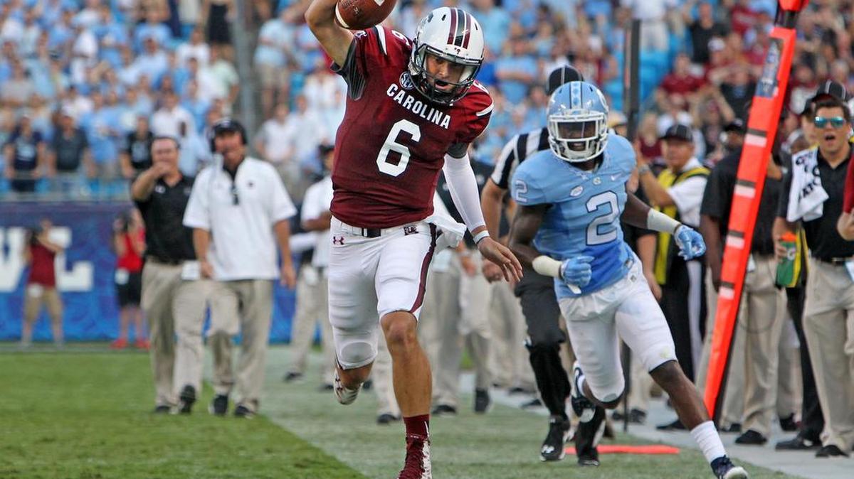 
USC quarterback Connor Mitch tip-toes the sideline on a keeper in the first half of Thursday’s win against North Carolina.
