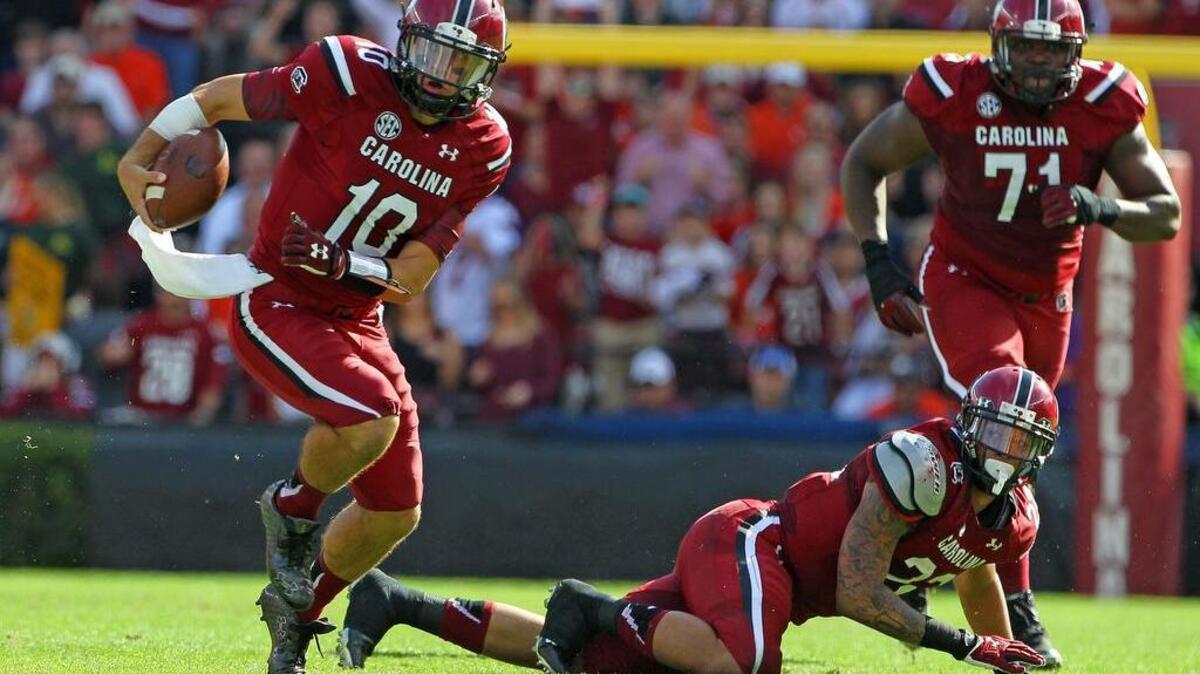 South Carolina Gamecocks quarterback Perry Orth (10) takes off running on a keeper against Clemson in the 2015 game.