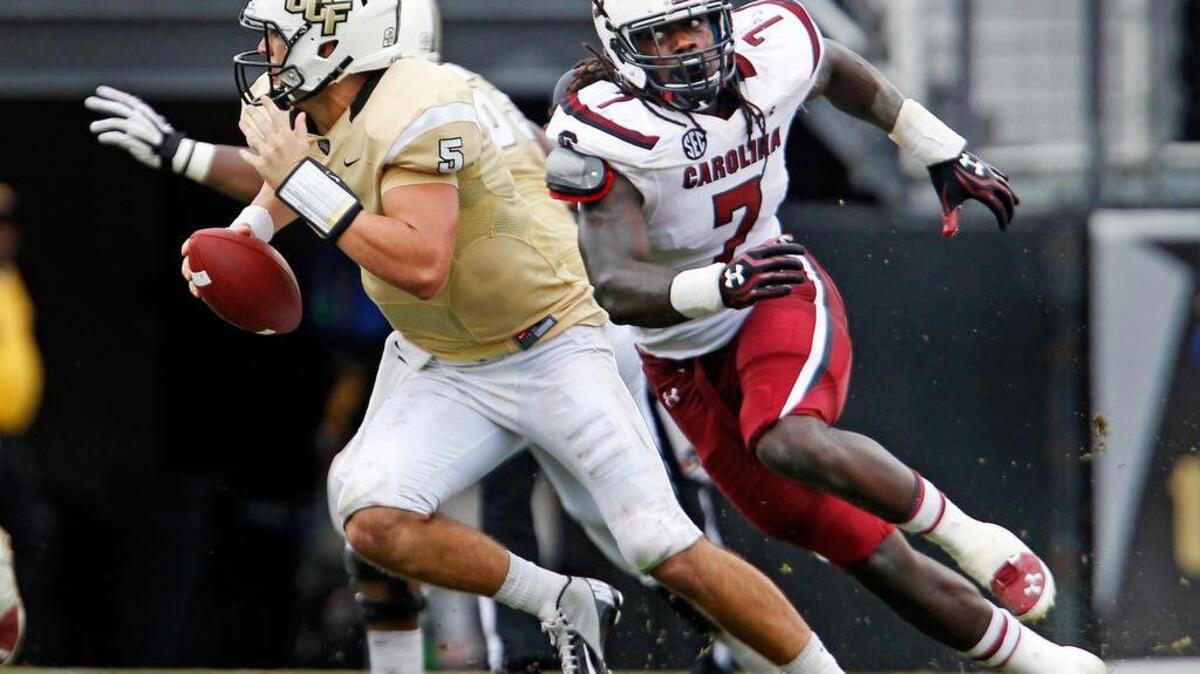 
From Sept. 28, 2013: UCF quarterback Blake Bortles (5) is pressured by South Carolina defensive end Jadeveon Clowney (7) at Bright House Networks Stadium in Orlando, Fla.
