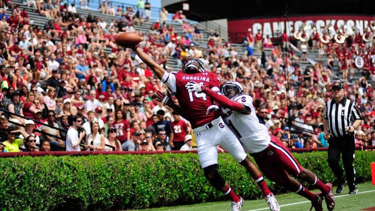 Receiver Shaq Davidson (14) and cornerback Rico McWilliams (1)